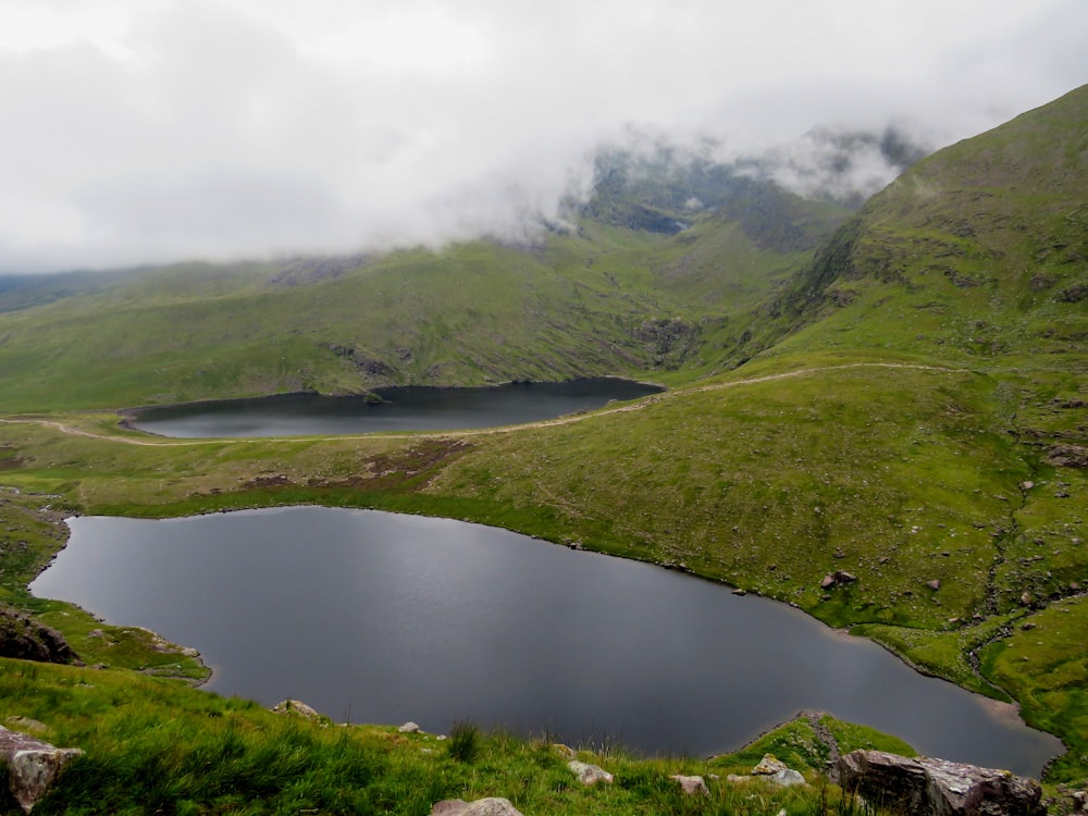 green mountains near lake during daytime