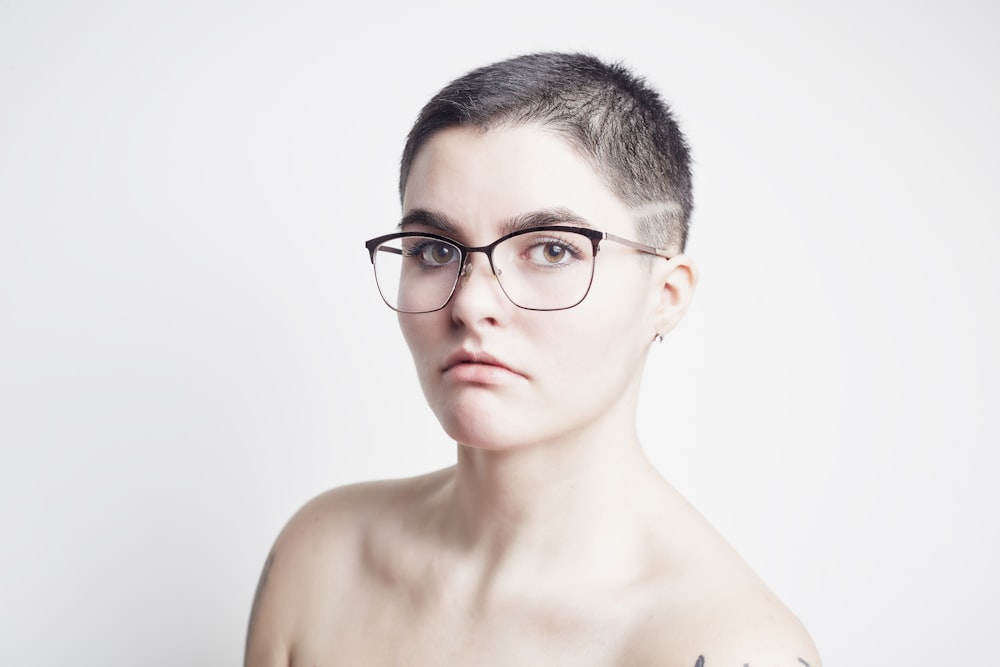 topless man wearing black framed eyeglasses