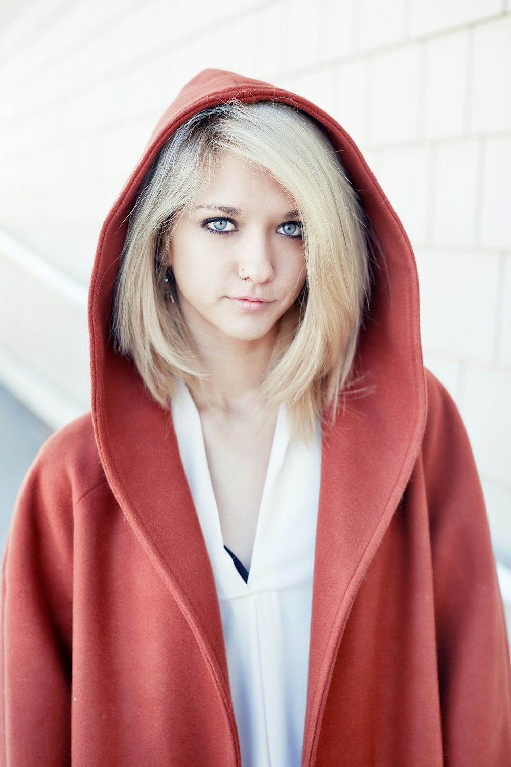 woman in red coat standing