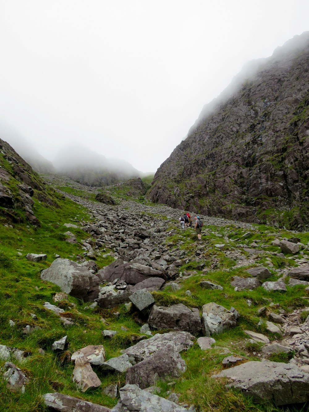 people hiking on mountain during daytime