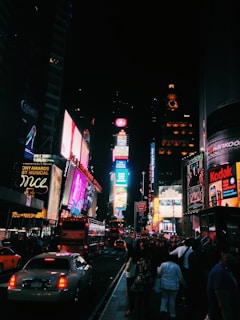 people walking on street during nighttime