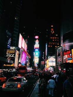 people walking on street during nighttime