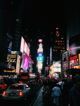 people walking on street during nighttime