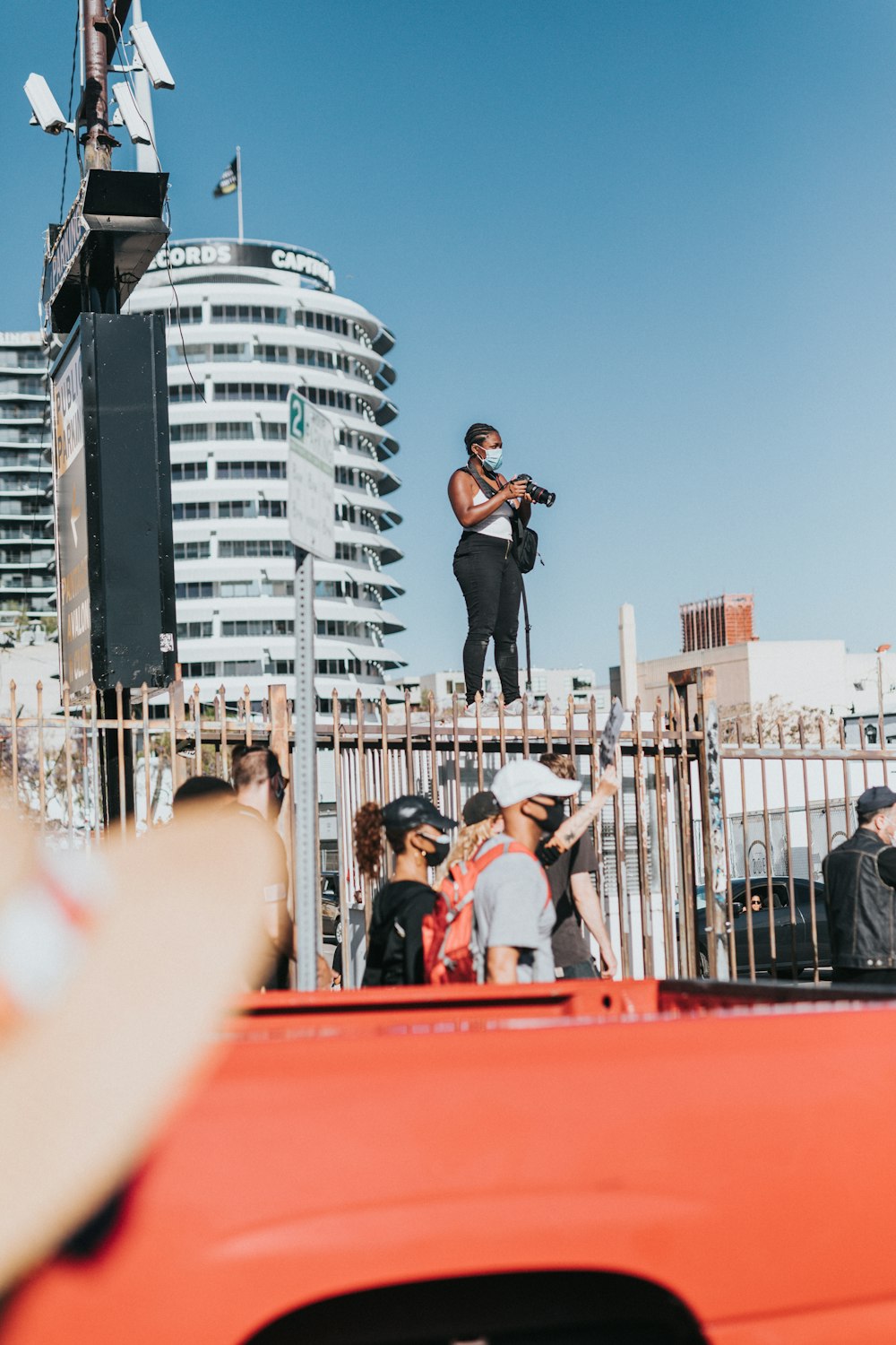 man in black t-shirt playing guitar