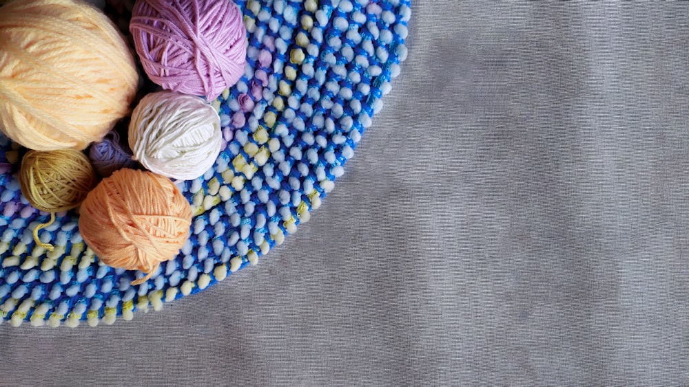 green yarn on brown woven round basket