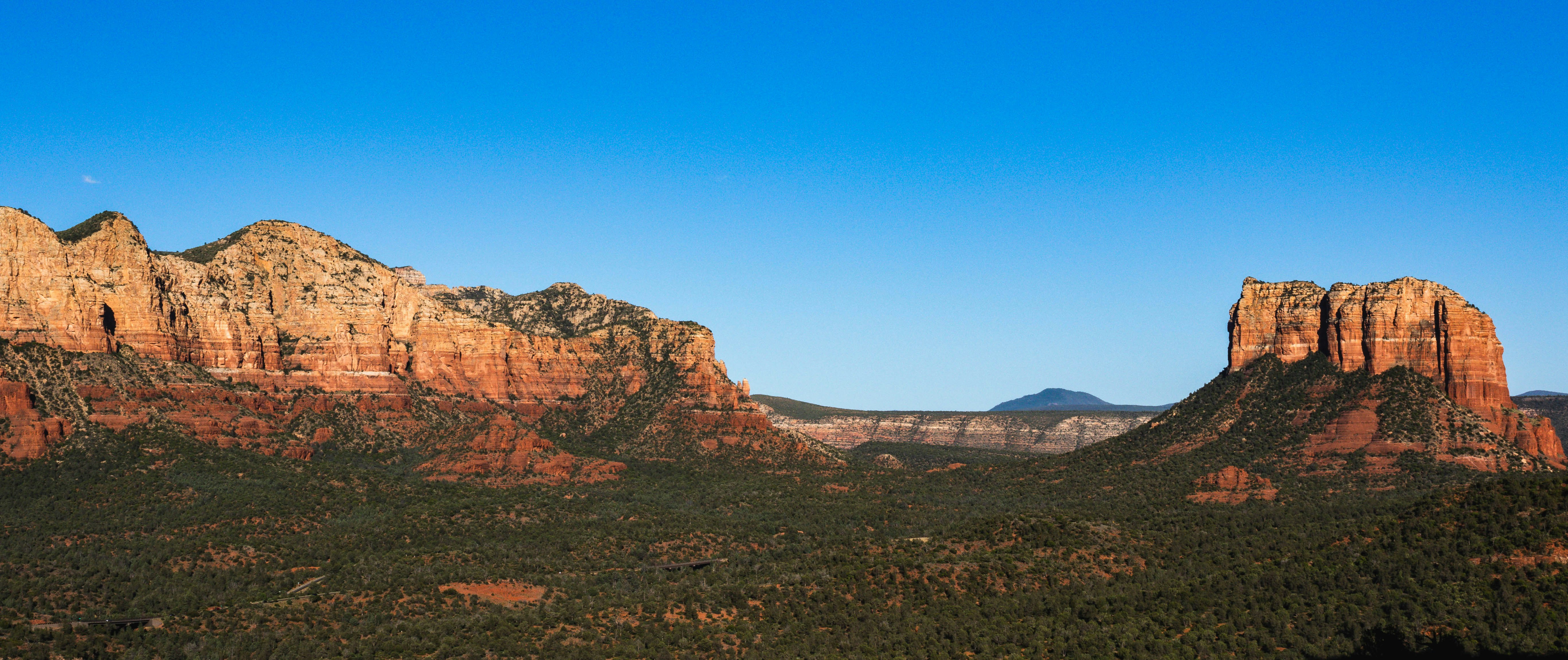 brown rocky mountain under blue sky during daytime