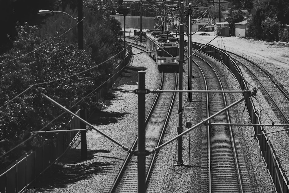 grayscale photo of train rail