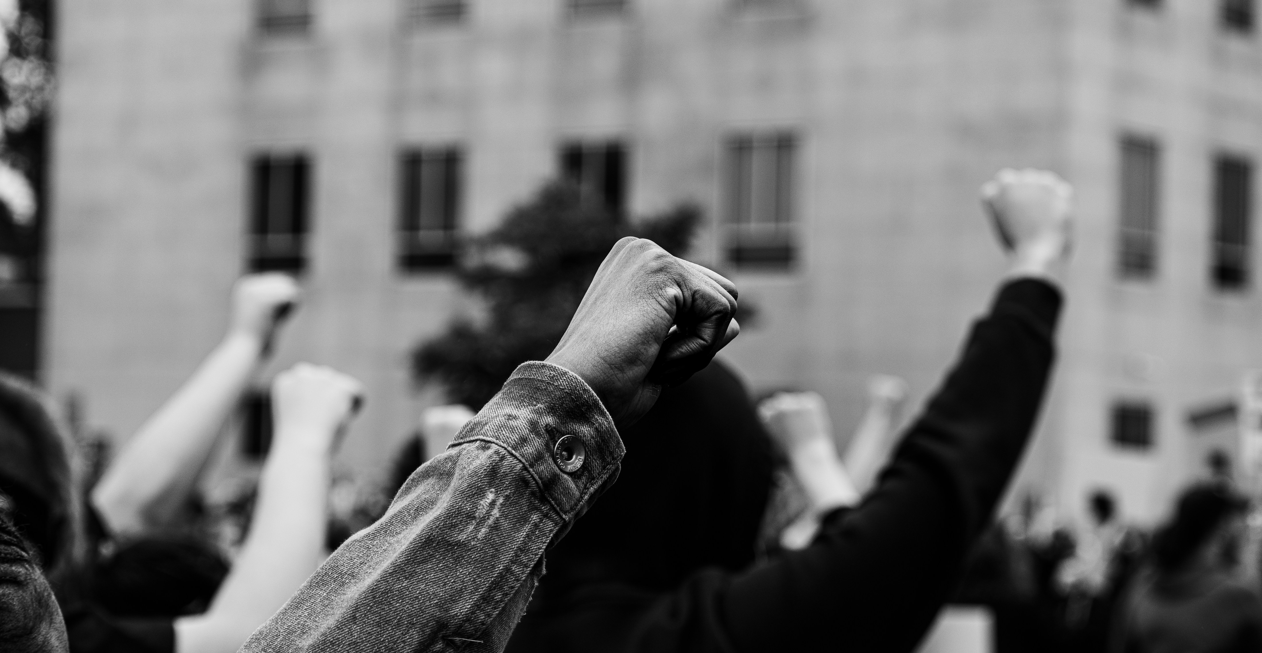 grayscale photo of man in long sleeve shirt
