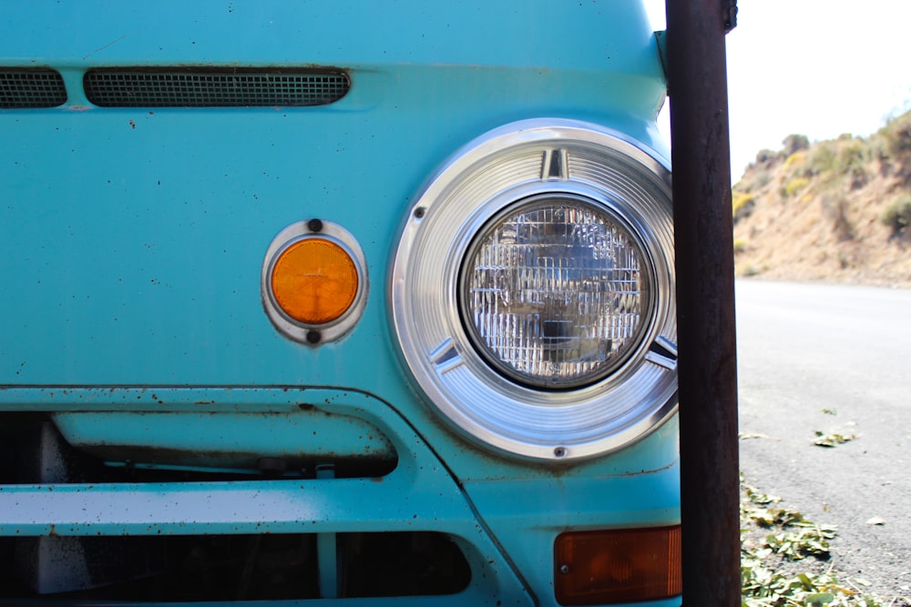 blue and silver car with white light