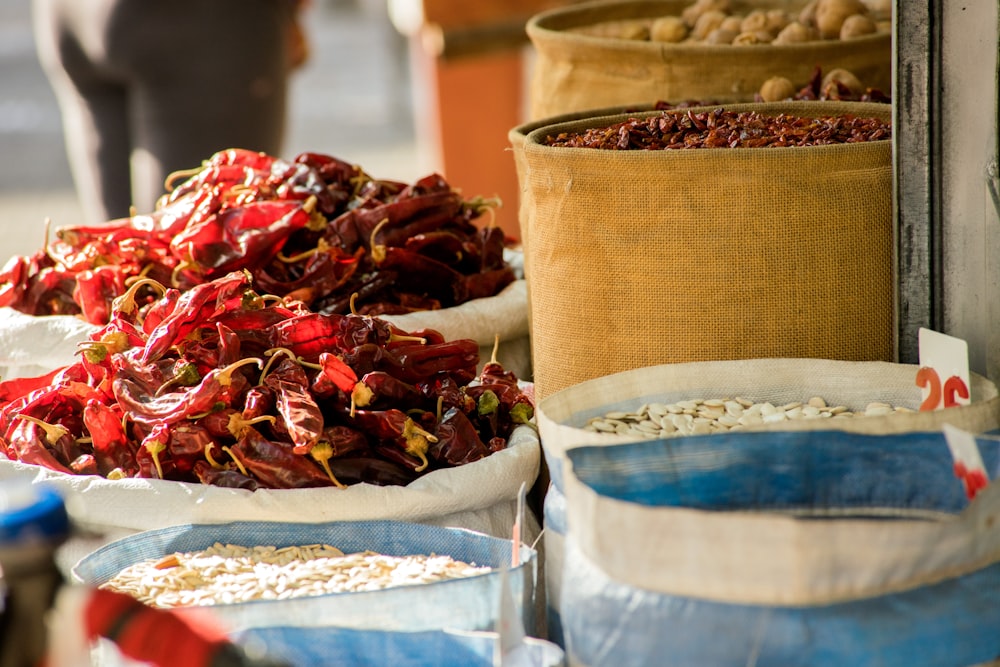 red and brown dried leaves on clear glass jars