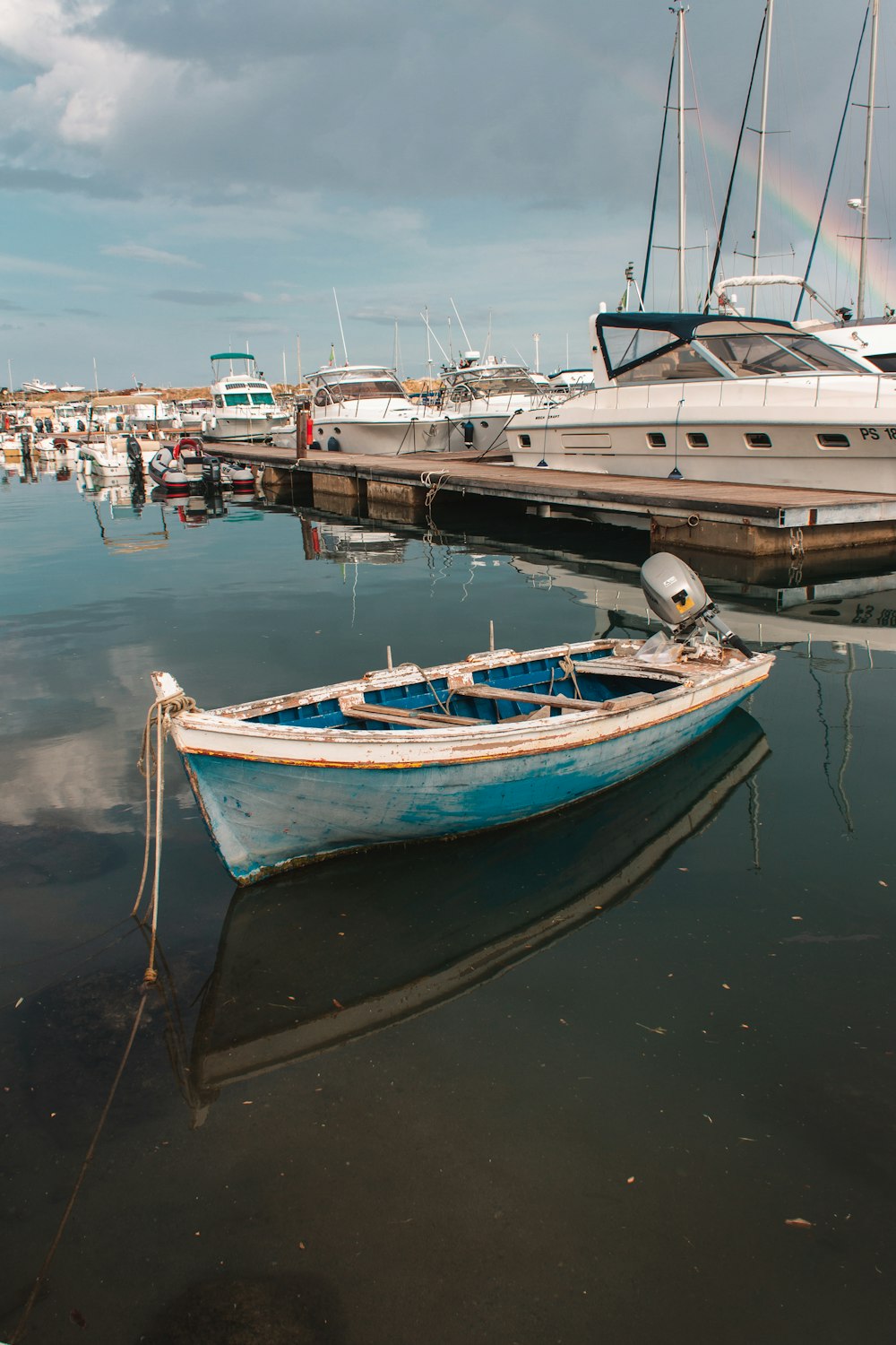 white and blue boat on water during daytime