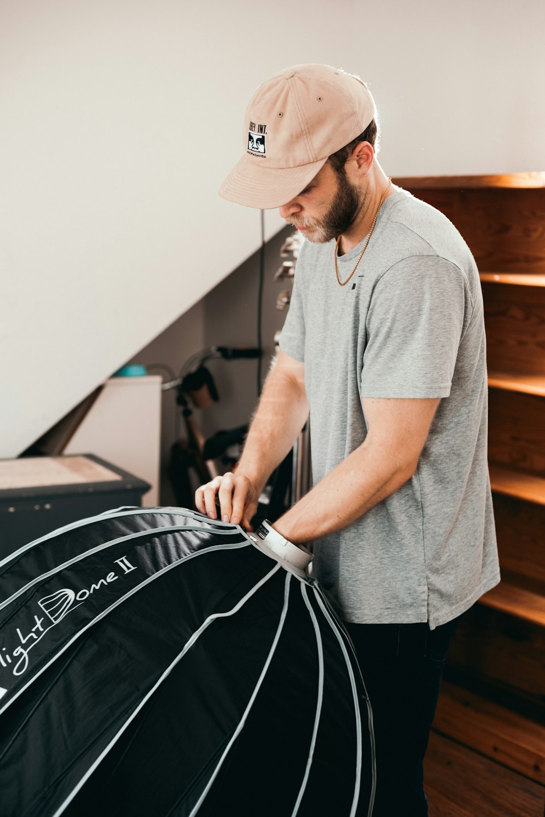 man in gray polo shirt and brown fedora hat