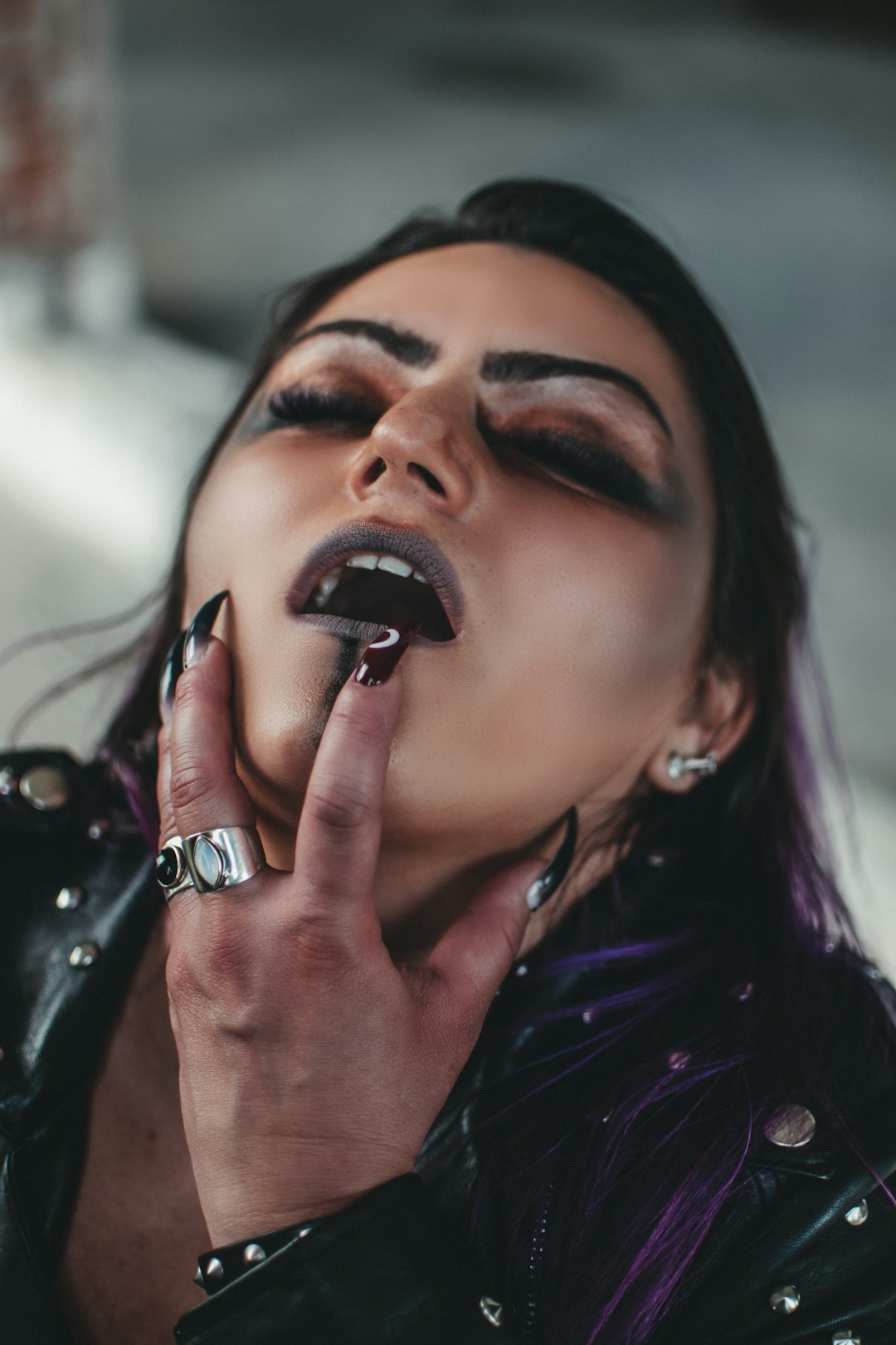 woman in purple shirt with silver ring