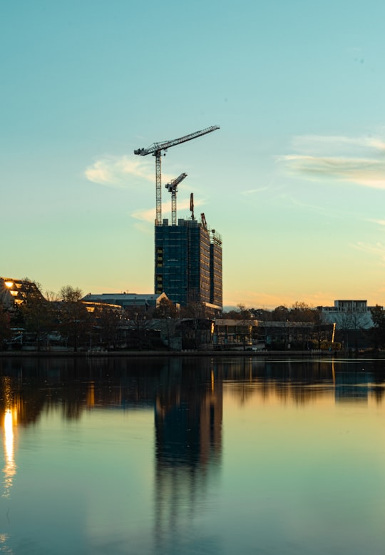 high rise buildings near body of water during daytime in Canberra ACT Australia