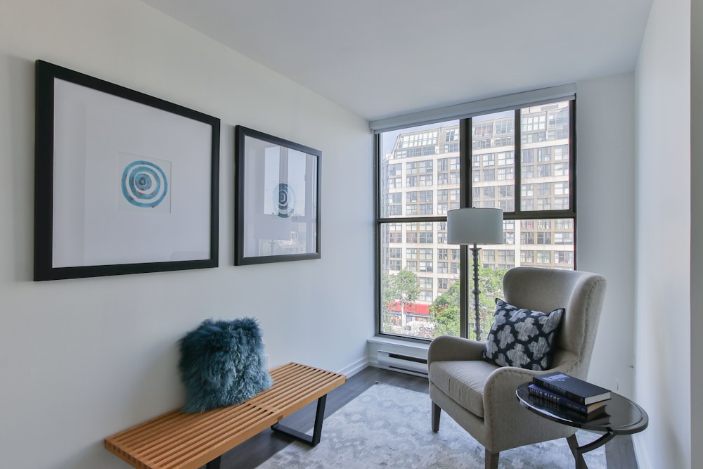 blue and black textile on gray couch