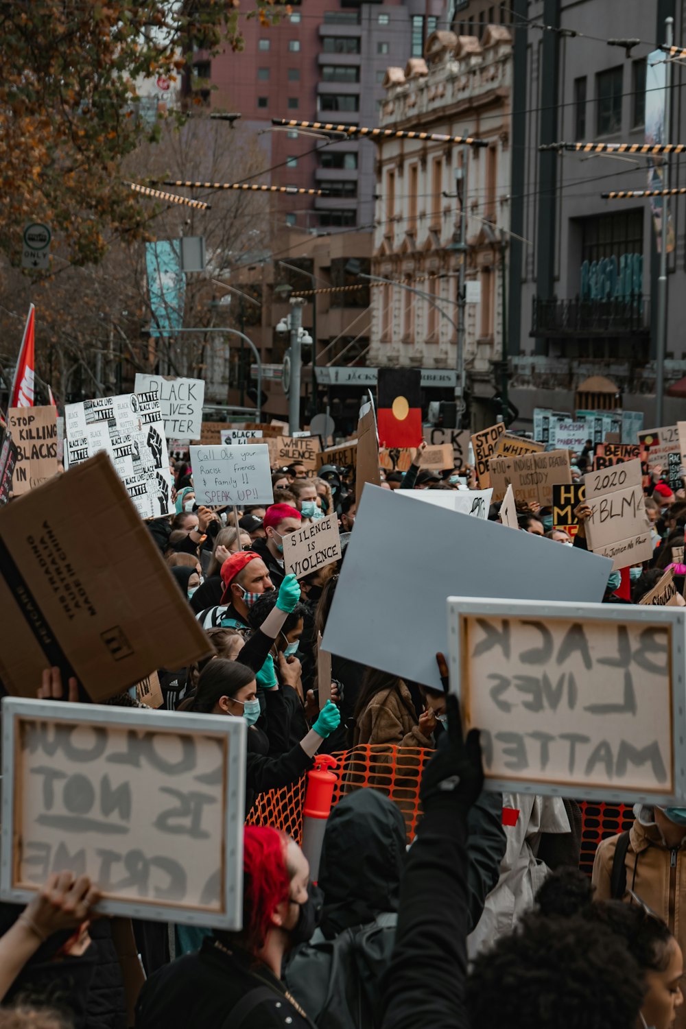 people holding white printer paper during daytime