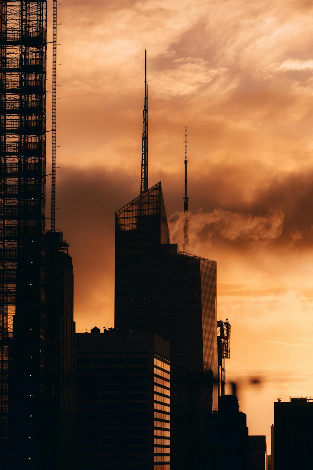 silhouette of city buildings during sunset