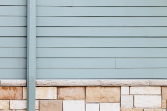 Close-up of new gray fiber cement siding on a Dayton home, highlighting clean lines and texture.