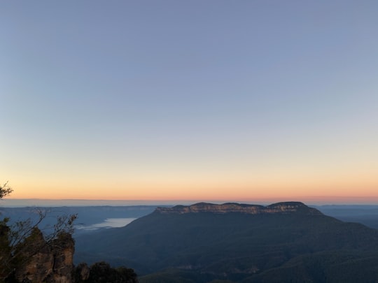 green mountains under blue sky during daytime in Blue Mountains National Park Australia