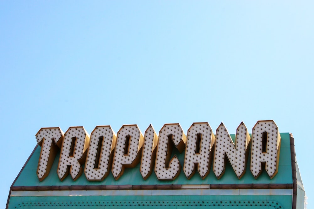 a sign for a casino with a sky in the background