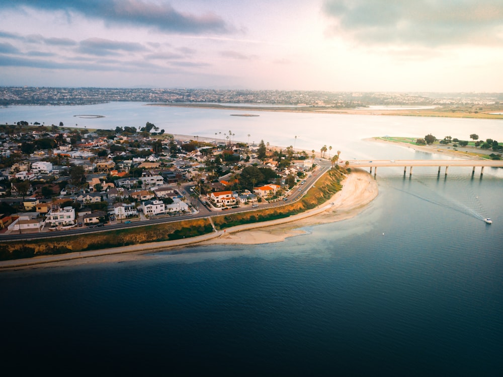 aerial view of city near body of water during daytime