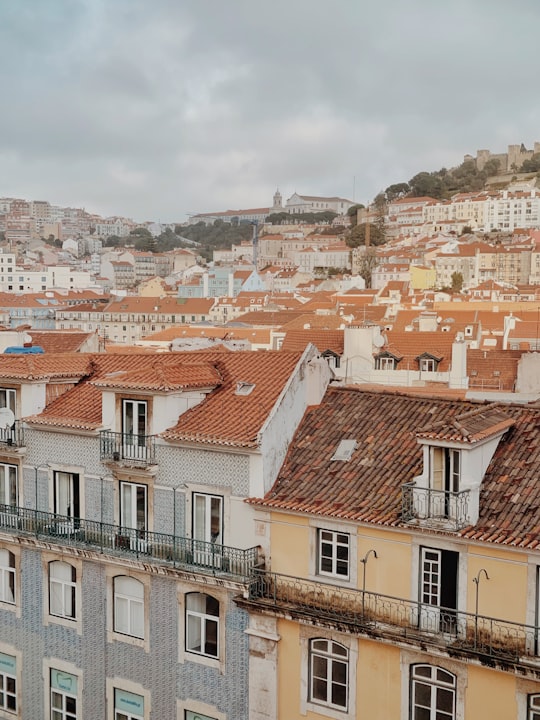 white and brown concrete building during daytime in Carmo Convent Portugal