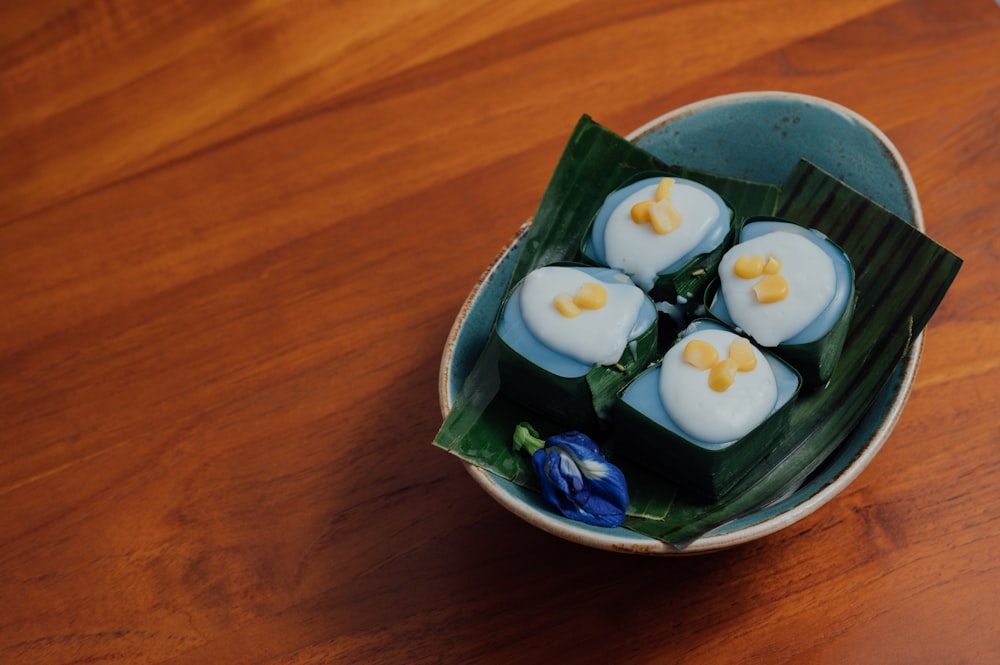 sliced white onions on green ceramic bowl