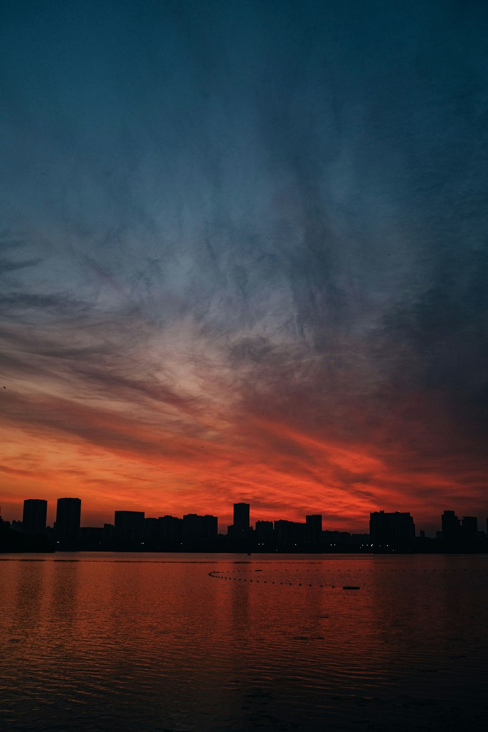 silhouette of city buildings during sunset