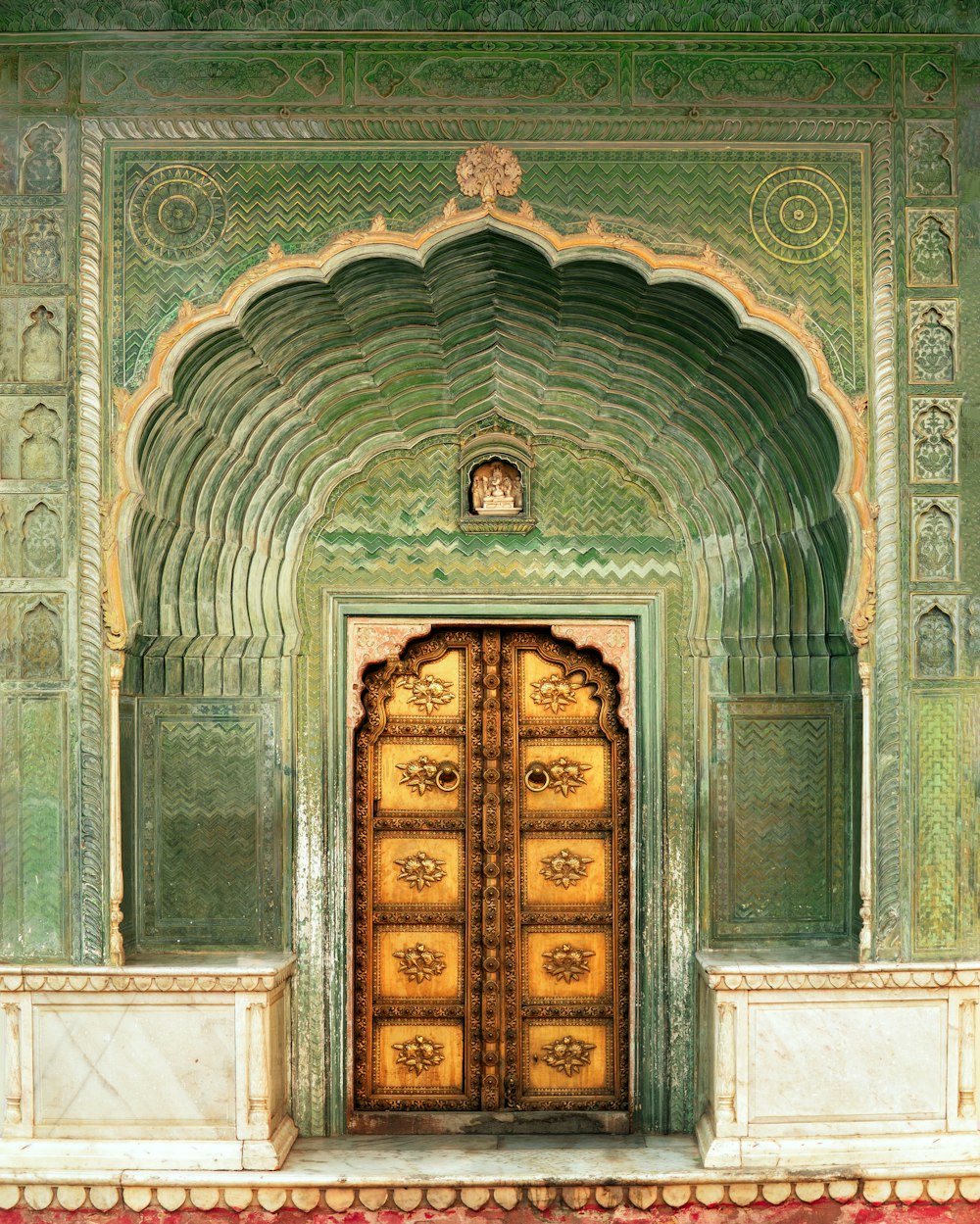 brown wooden door on gray concrete building