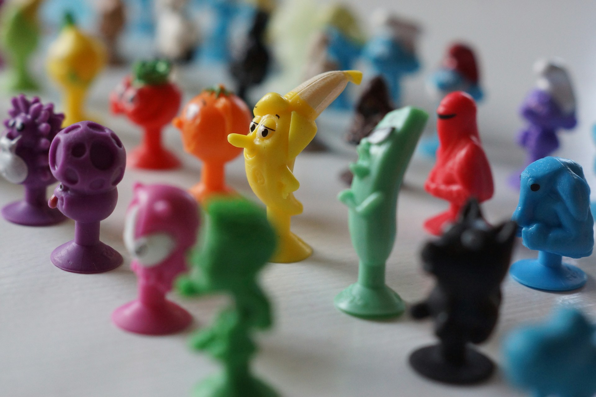 pink and yellow plastic animal toys