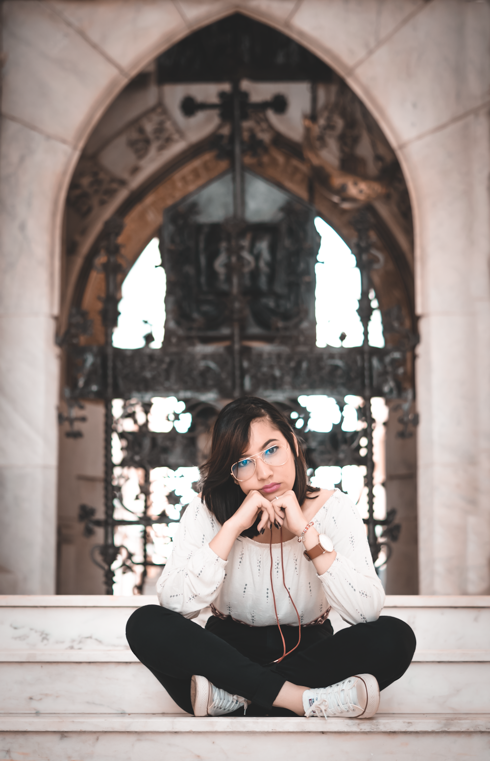 woman in white long sleeve shirt covering her face