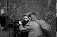 A behind-the-scenes look at a Titan Videos team member reviewing footage with a client.