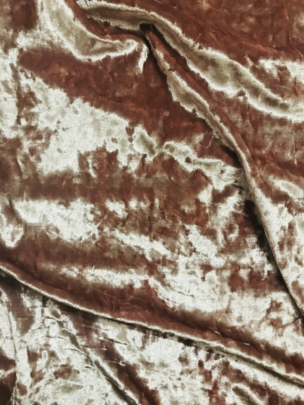 brown and white floral textile