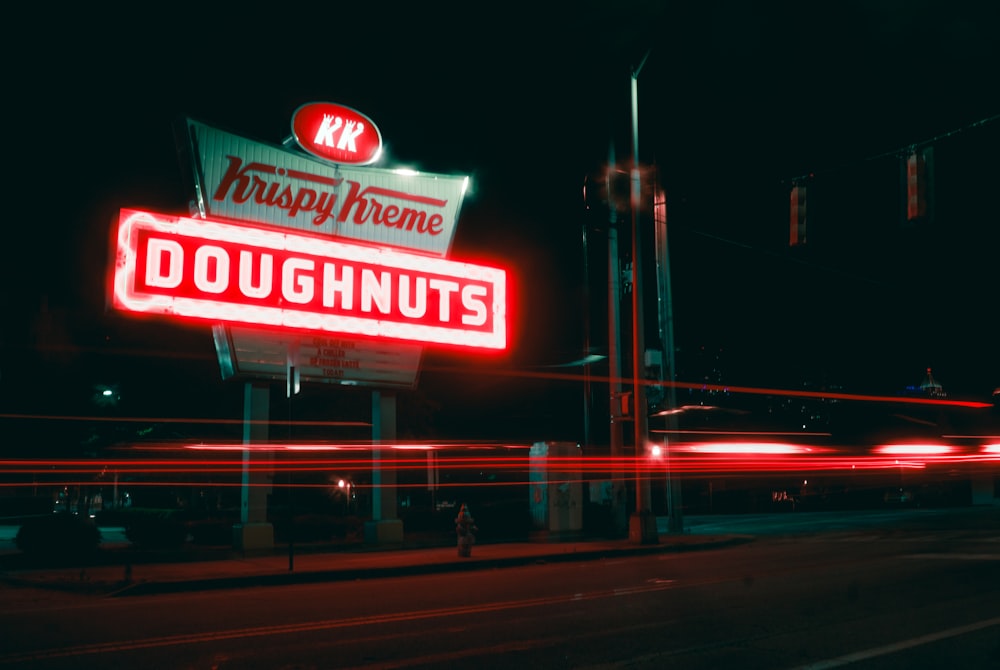 red and white UNKs coffee building during night time