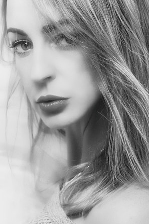 A detailed digital portrait of a woman with expressive eyes and soft brush strokes.