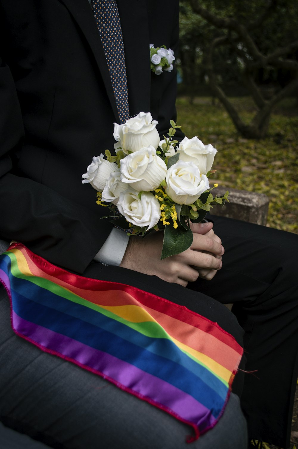 person holding white rose bouquet