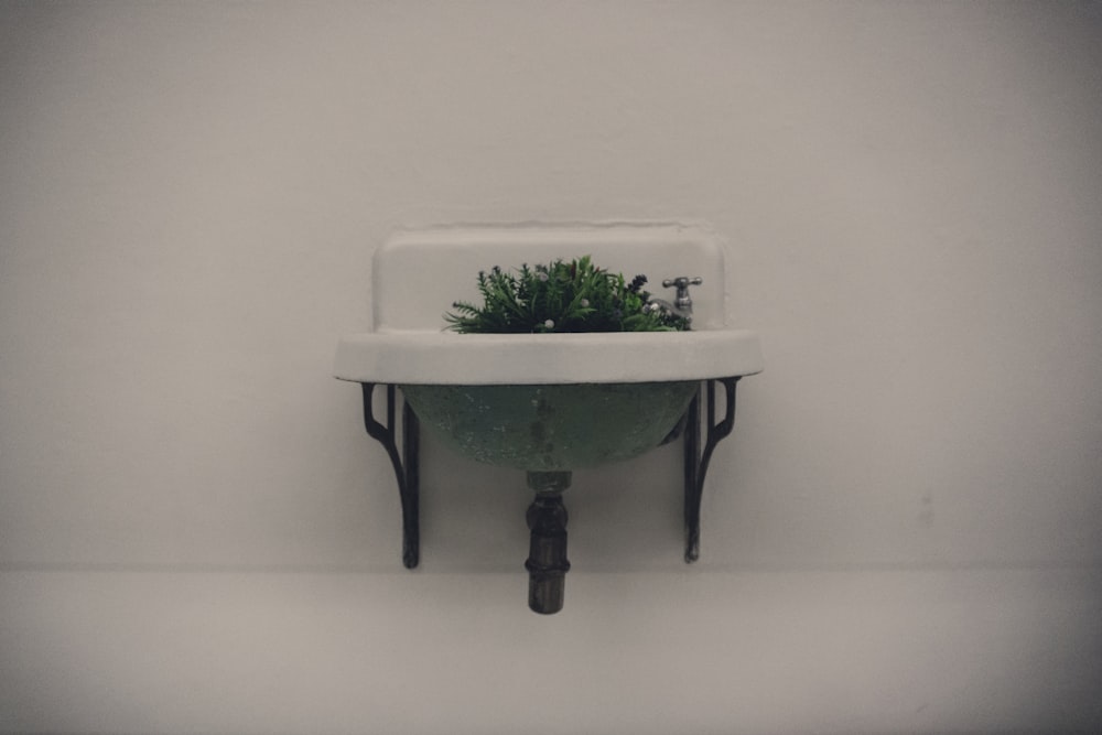 white ceramic bowl on black wooden table