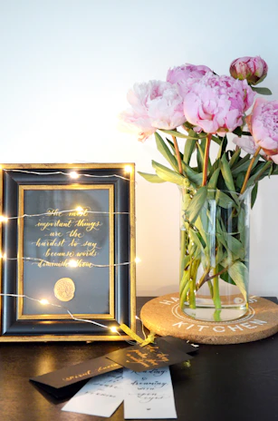 A selection of bookmarks with unique inspirational quotes in gold script, elegantly arranged over a velvet deep purple cloth.