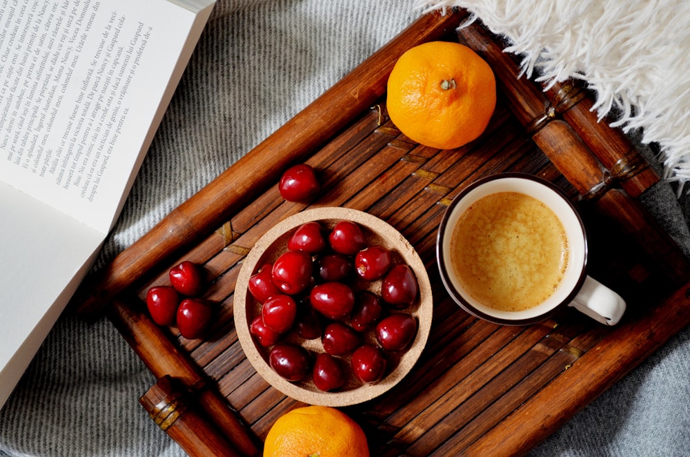 orange fruit on brown wooden tray