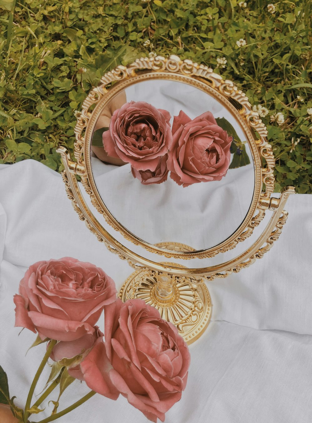 red roses on white textile