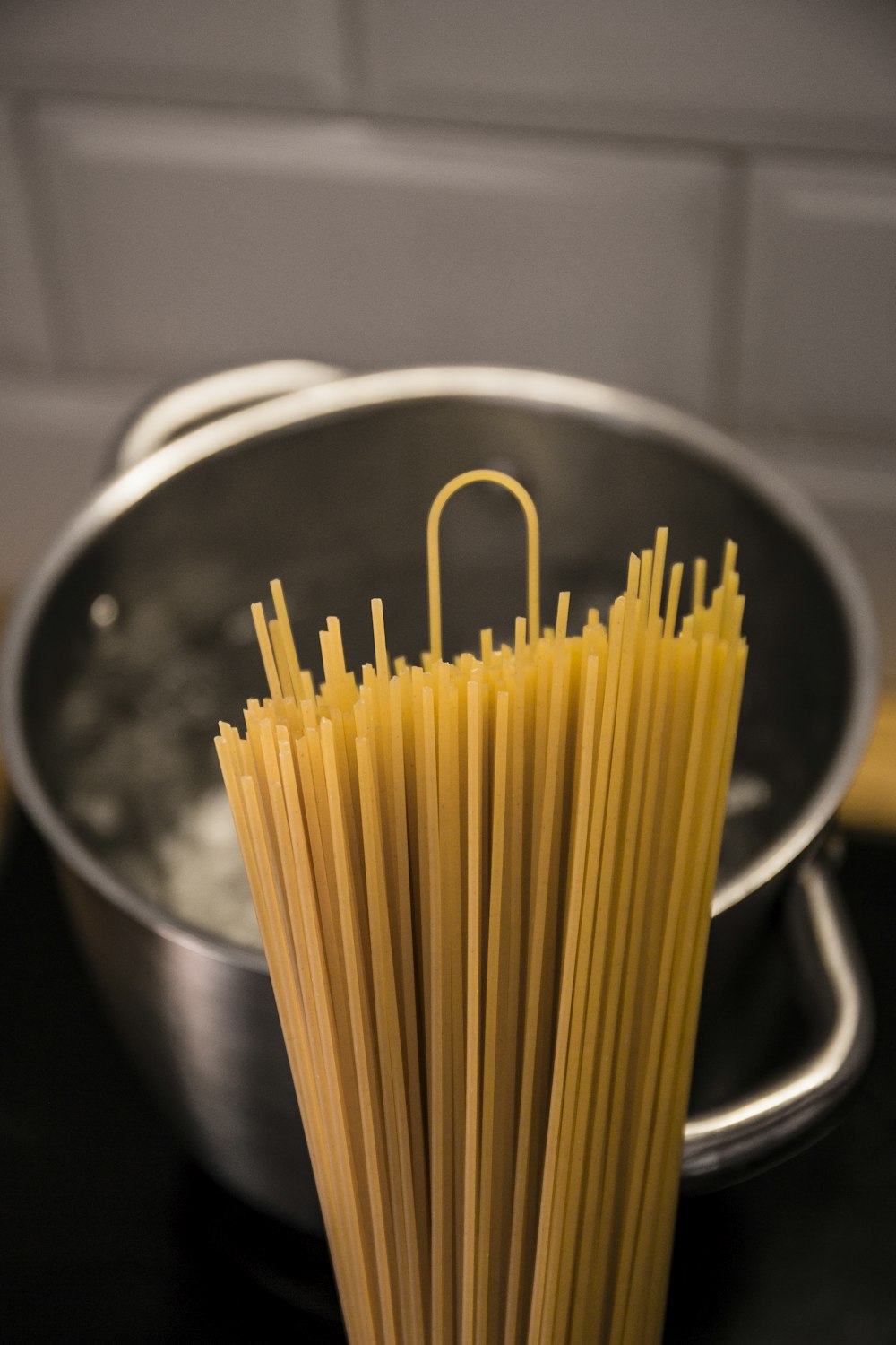 yellow pasta on stainless steel bowl