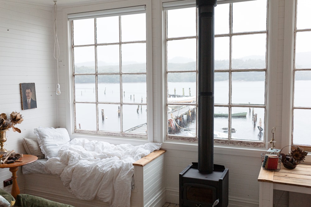 white bed linen on bed