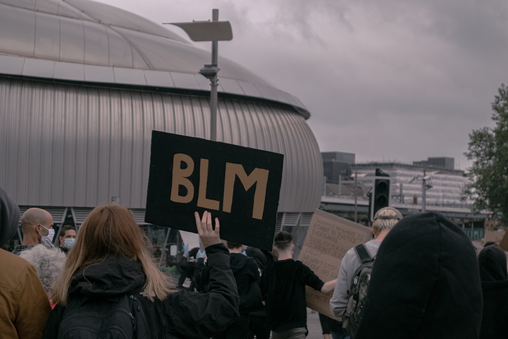 people standing near white building during daytime