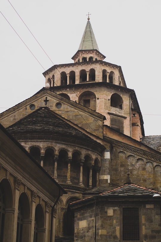 brown and black concrete building under white sky during daytime in Basilica of Santa Maria Maggiore Italy