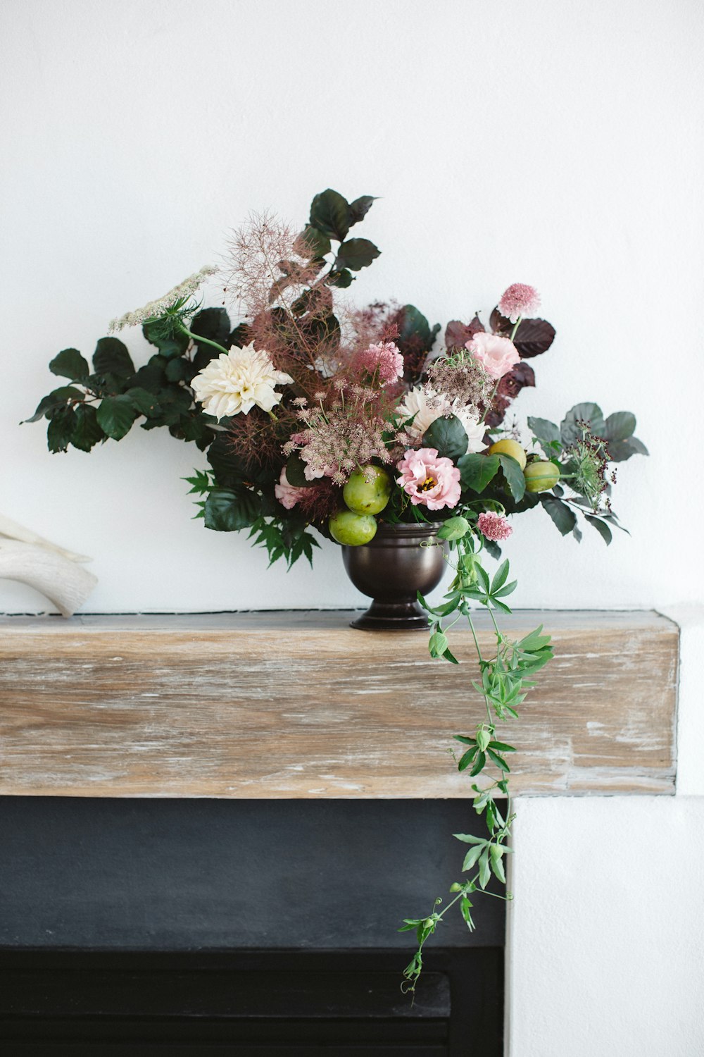 red and white flowers on brown wooden table