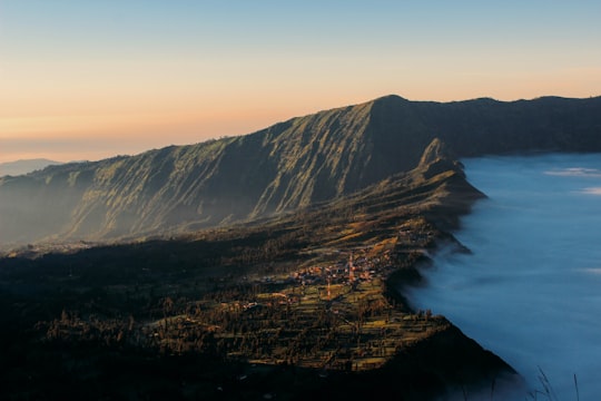 aerial view of city near body of water during daytime in Bromo Tengger Semeru National Park Indonesia