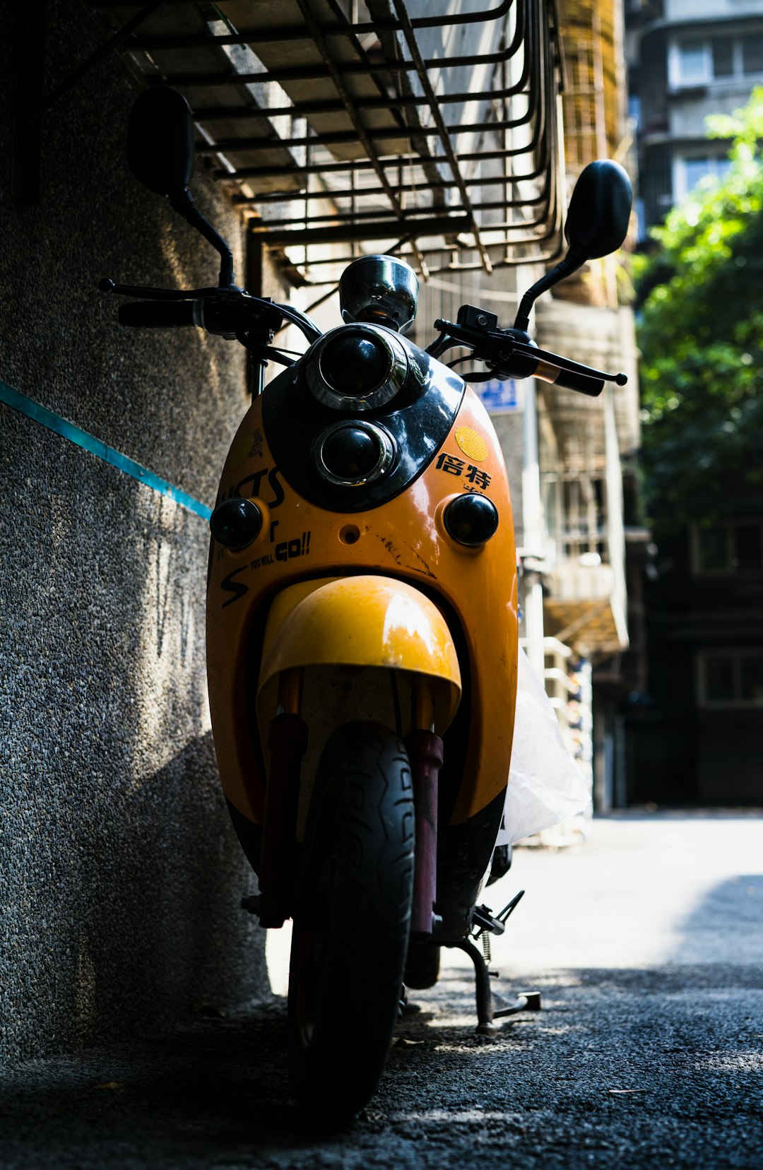 yellow and black motorcycle on gray concrete road during daytime