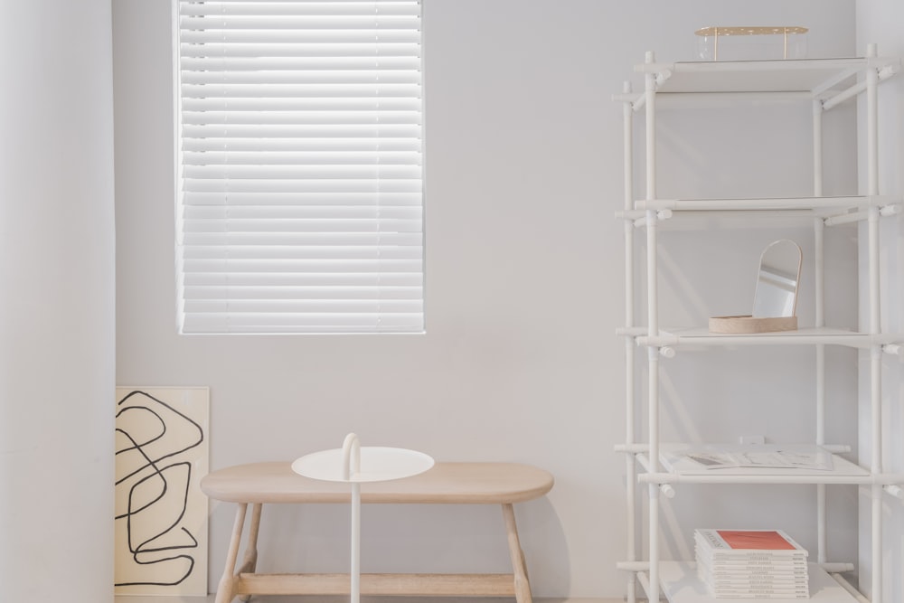 white wooden chair beside white table