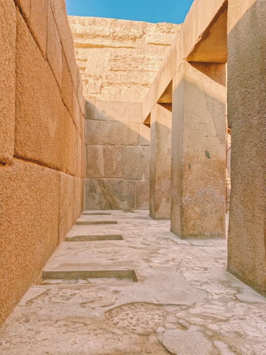 brown concrete wall during daytime in Saqqarah Egypt