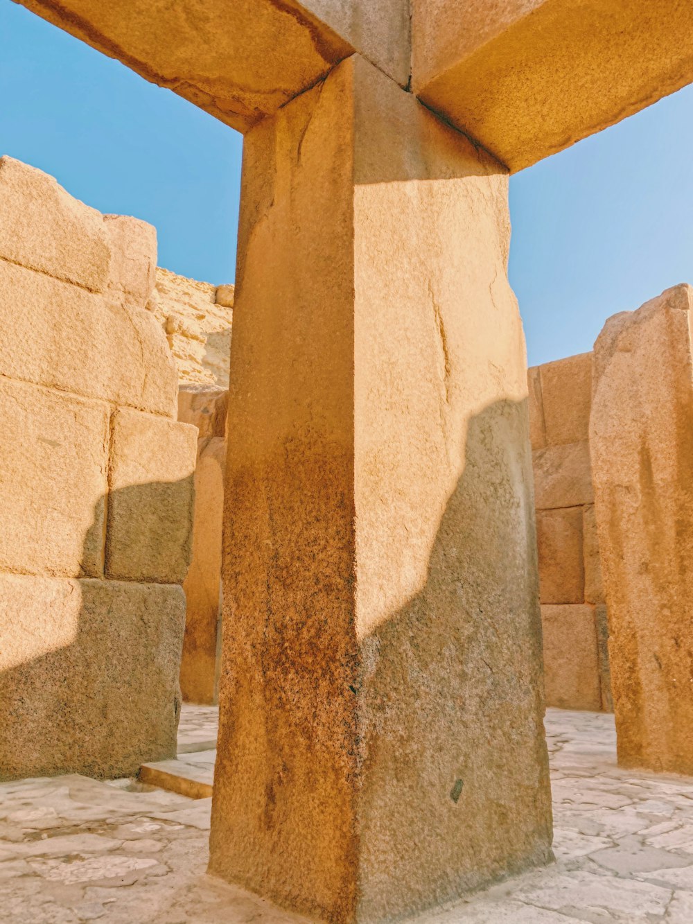 brown concrete pillar under blue sky during daytime